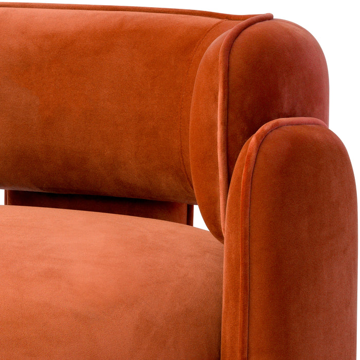 Sillón Eichholtz Chaplin en tejido de terciopelo naranja Savona